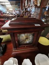 An Antique mahogany mantle clock bib HOWARD MILLER