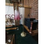 An Antique brass and ruby glass reading lamp