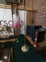 An Antique brass and ruby glass reading lamp