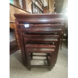 A set of 4 Chinese mahogany style nest of tables