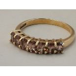 A 9 carat gold pink sapphire ring