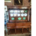 A 20th century quality oak dresser with rack and h