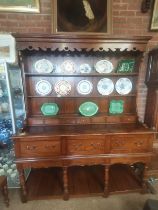 A 20th century quality oak dresser with rack and h