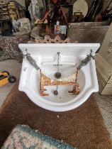 Antique sink with brackets, cast iron ceiling rose and Victorian tiles