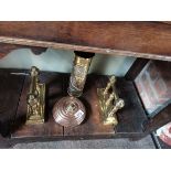 A collection of brassware