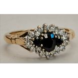 A 9ct gold wedding style ring with 3 x blue stones