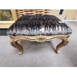 An Antique gilt dressing stool with newly removed