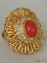 An 18k gold highly decorative ring with raised sto