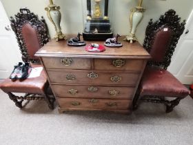 A pair of Antique carved hall chairs with leather