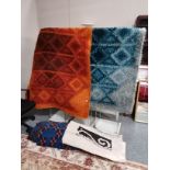 4 x rugs - orange, large blue, smaller blue and cream and black