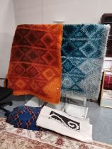 4 x rugs - orange, large blue, smaller blue and cream and black