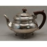 A GEORGE V SILVER TEAPOT