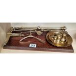 Vintage Librasco brass balance scales with a full set of matching weights.