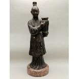 A bronze Japanese figurines of a boy on marble stand