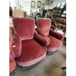 A pair of Howard style armchairs with turned legs
