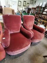 A pair of Howard style armchairs with turned legs