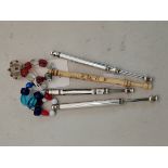 Four lace bobbins, including silver examples
