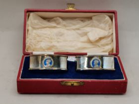 A PAIR OF GEORGE VI SILVER COMMEMORATIVE NAPKIN RINGS