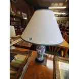An oriental table lamp in the famille rose style pattern