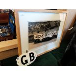 A limited edition photo of Stirling Moss plus a vintage RAC GB badge