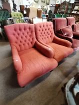 A pair of Howard style armchairs with turned legs