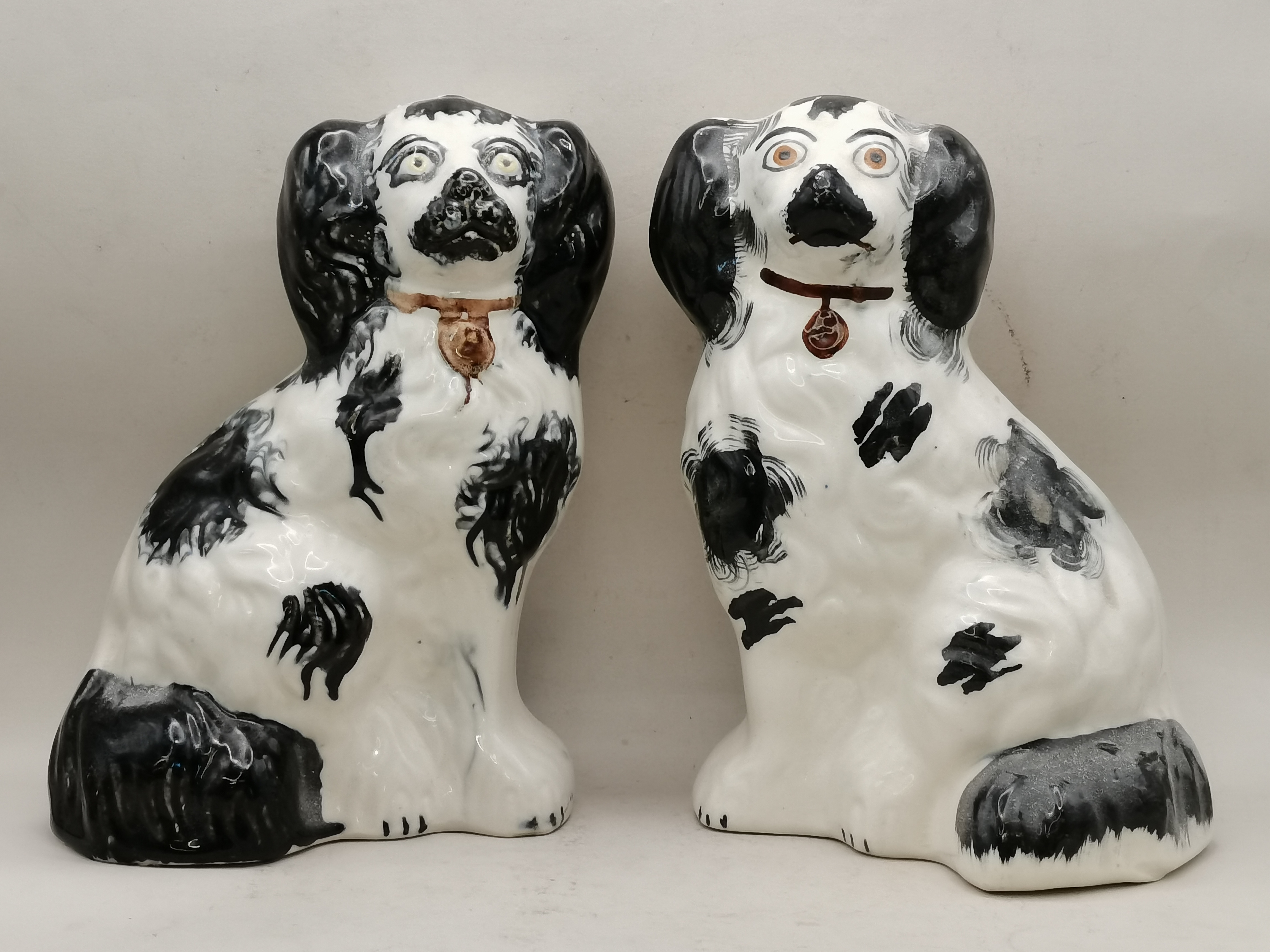 Pair of black and white seated Staffordshire spaniel dog figures 20cm Ht - Image 2 of 3