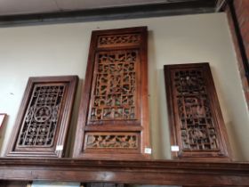 A set of 3 Chinese wall plaques with pierced flora