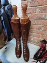 A Pair of Leather Riding Boots With Wooden Lasts