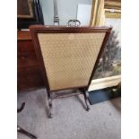 Antique mahogany firescreen with sabre legs and 3