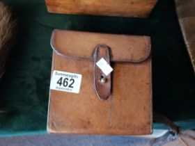 A leather shooting pouch