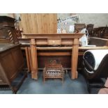 Pine fire surround and cast iron fire basket with back