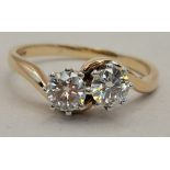 A 9ct gold ring with 2 x white stones size R