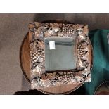 Small mirror with highly decorative frame