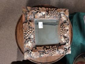 Small mirror with highly decorative frame