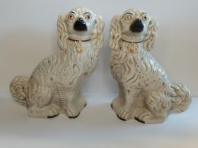 Pair of white seated Staffordshire dogs 33cm Ht