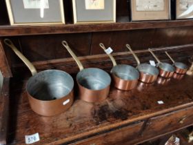 A set of 6 copper cooking pans largest 16cm