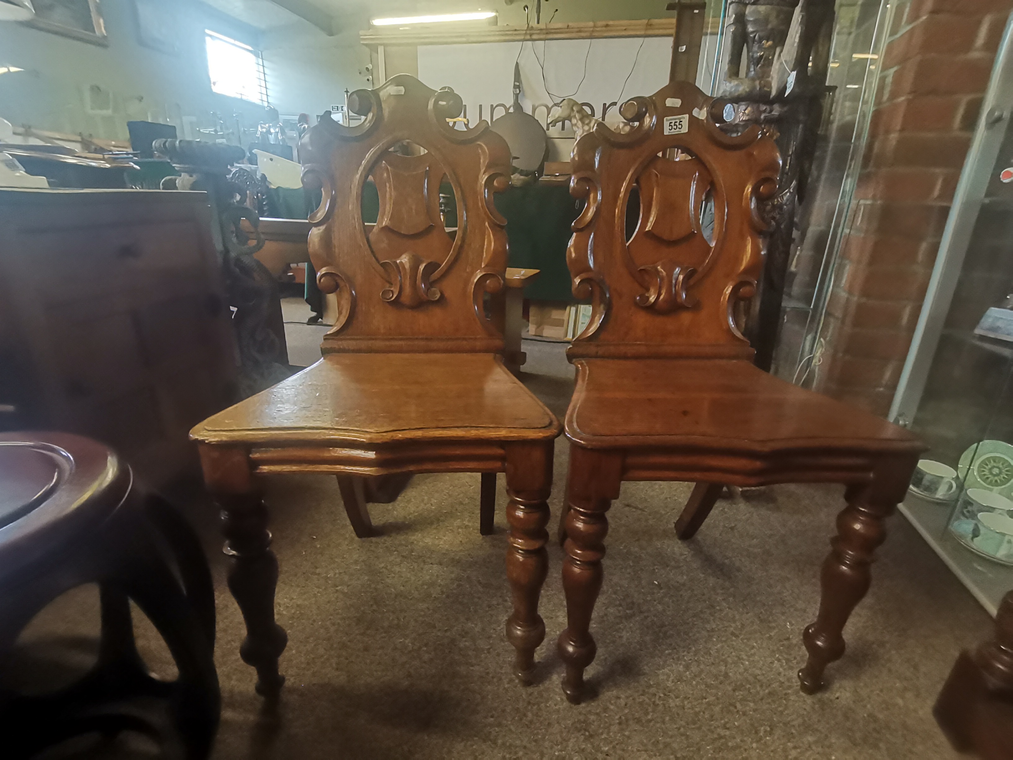 A pair of oak Antique hall chairs