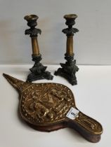 Pair of ornate candlesticks and brass bellows