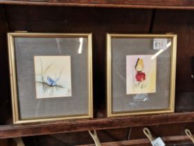 A pair of small paintings of butterflies