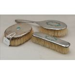 TWO LIBERTY & CO SILVER-BACKED DRESSING TABLE BRUSHES, AND ANOTHER