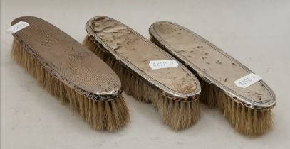 THREE SILVER-BACKED DRESSING TABLE BRUSHES