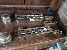 A collection of miniature brass fenders and pair o
