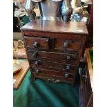 An Antique mahogany apprentice chest of drawers