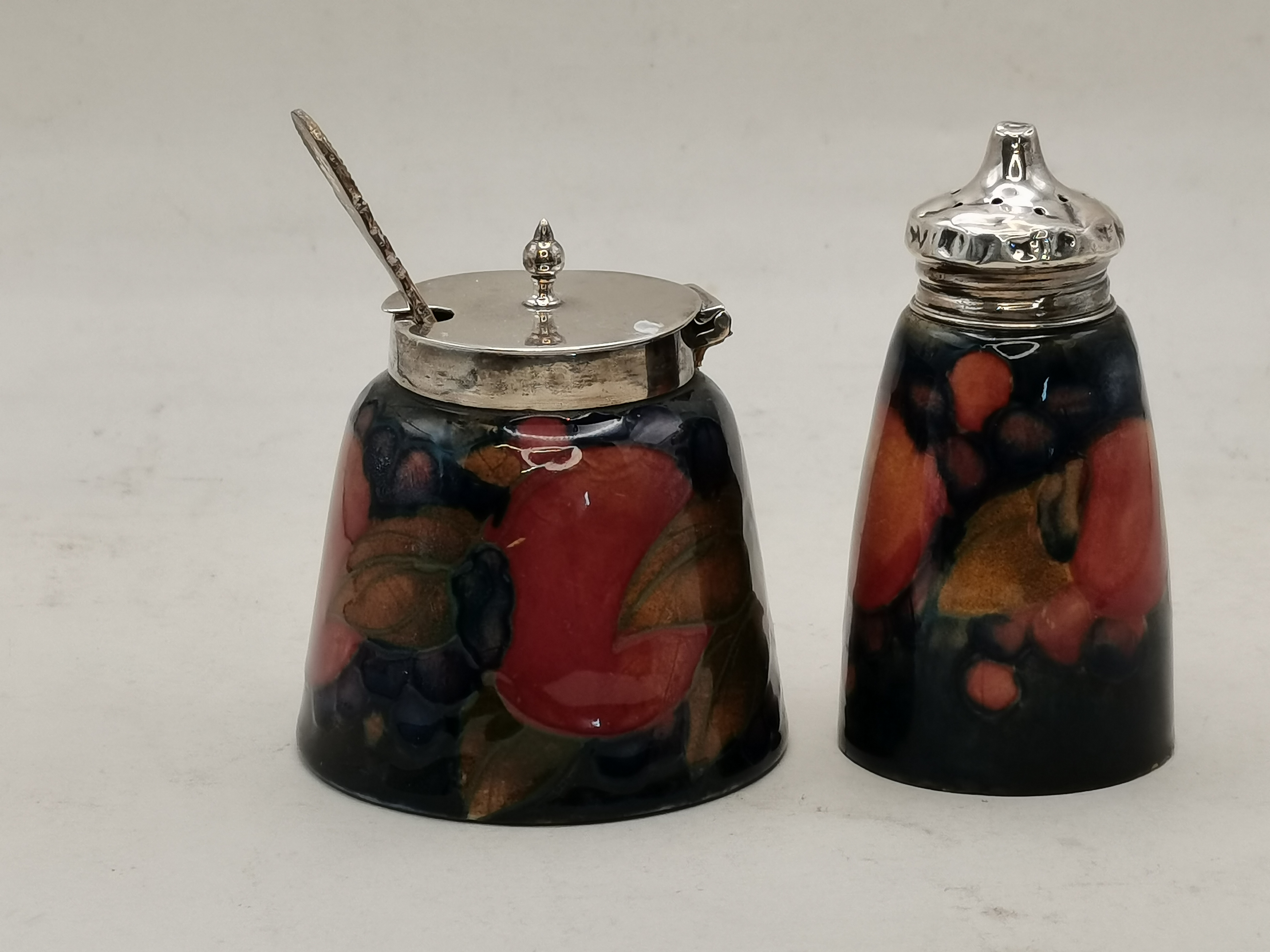 Moorcroft pomegranate and silver 2 piece cruet set with spoon ( chip to base )