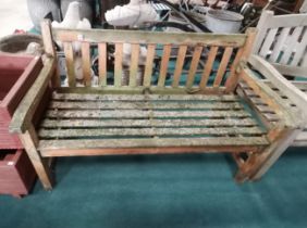 Wooden garden bench in need of restoration