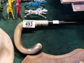 An Antique ebony, silver and horn walking stick