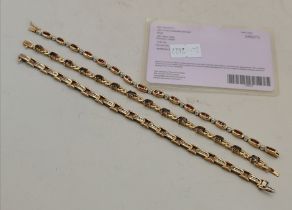 A 9 carat gold andalusite bracelet, and two others