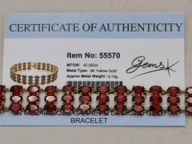 A 9 carat gold Mozambique garnet and diamond bracelet