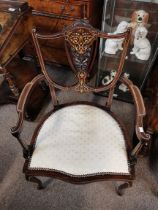 AnAntique armchair with highly decorative marquetr