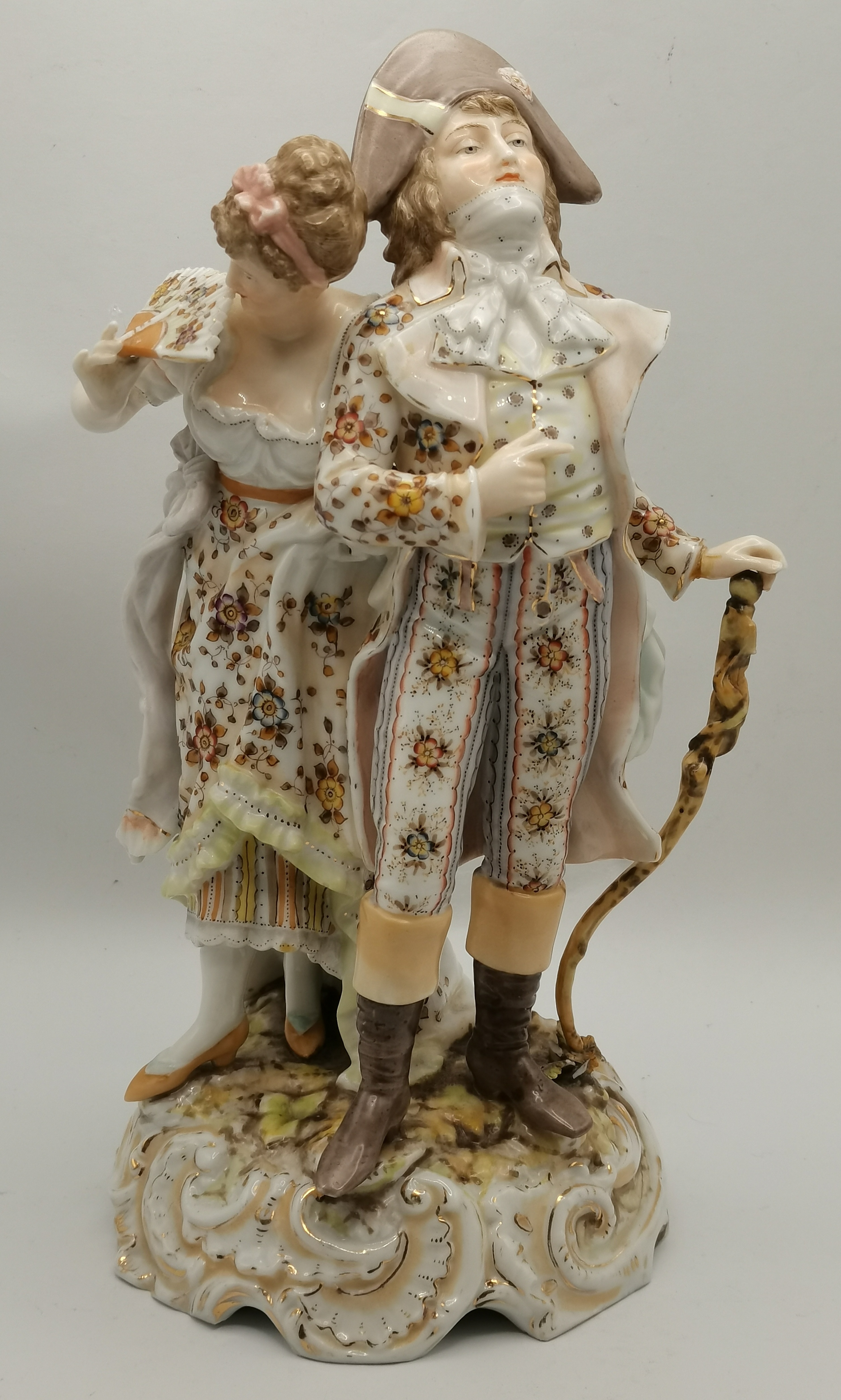 A Sitzendorf porcelain figure of a man and lady